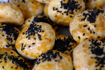 Delicious homemade black cumin and cheese pastries. Cactus ivy in the background. Parsley and cheese breakfast pastries. Ramadan iftar menu. Traditional Turkish pastries.