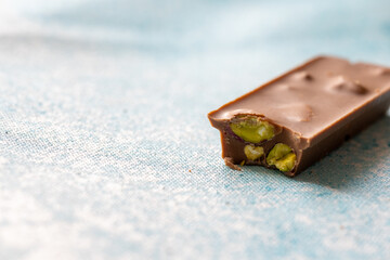  Close-Up of Pistachio Chocolate on Blue Background
