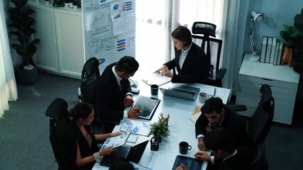 Top view of female leader looking financial statistic at business meeting. Professional marketing team looking and analyzing stock market investment graph and planning strategy. Teamwork. Directorate. - Powered by Adobe