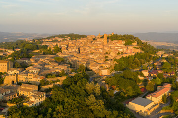 Obraz premium Historic hilltop town at sunset - Volterra, Italy