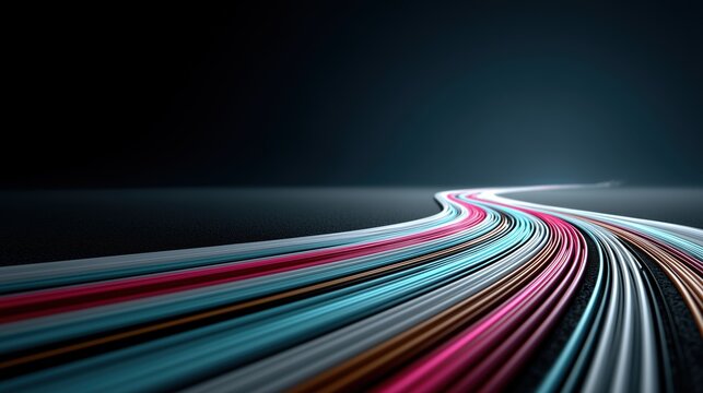 Futuristic highway of glowing colorful light trails moving rapidly into the dark distance.

