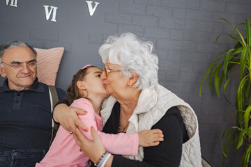 Sweet moment of grandma and granddaughter at home