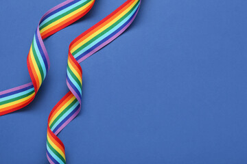 Rainbow ribbons on blue background. LGBT concept