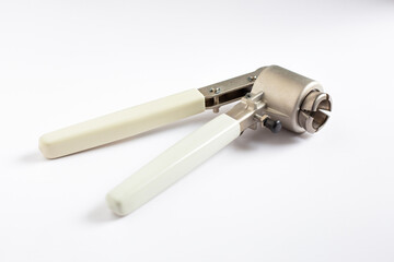 A manual vial crimper tool used to seal aluminum caps onto glass autosampler vials. Essential equipment for securing samples prior to chromatography analysis in a laboratory.