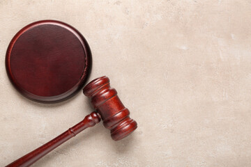 Judge's gavel on light grunge background