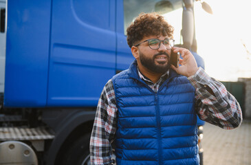 Truck driver talking on phone discussing logistics