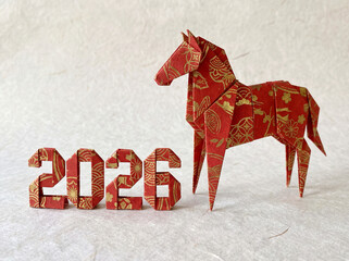 Red Origami Horse with 2026 Numbers on Textured Paper