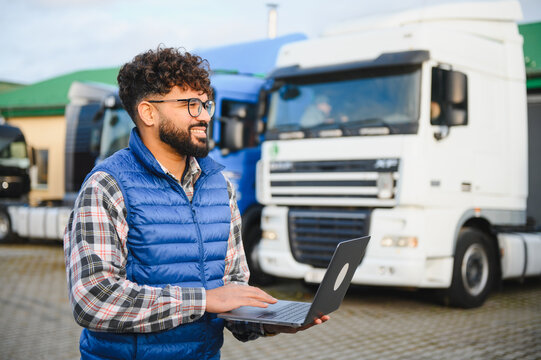 Indian truck driver using laptop for logistics planning - Powered by Adobe