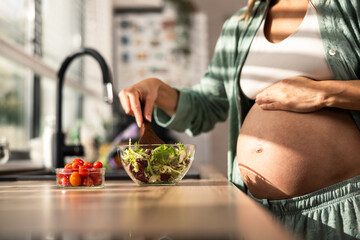Pregnant Woman Preparing Salad