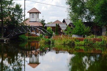 Obraz premium house by the lake and reflection in the lake water