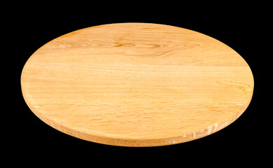 Round wooden board isolated on black background.