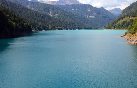 view of lake sauris in the carnia region of northeast italy and the surrounding mountains