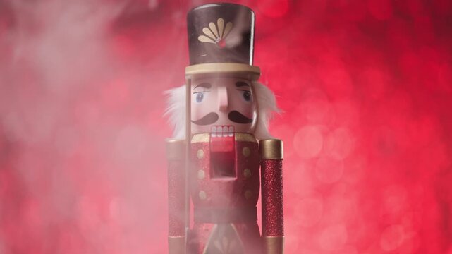 Vibrant bokeh lights illuminate a  Toy Nutcracker, standing surrounded by smoke, portrait in studio