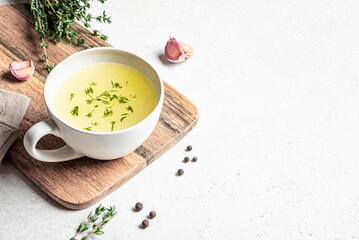 Hot healing bouillon (chicken bone broth) with herbs