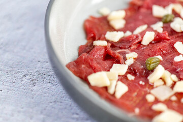 Beef Carpaccio cold appetizer with parmesan