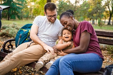 Joyful family moment in the park during a sunny afternoon