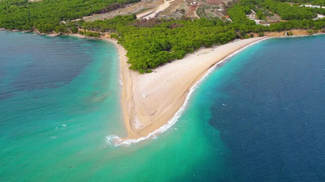 Aerial view of Zlatni Rat beach, Brac Island, Croatia. Its unique shifting shape and vibrant turquoise waters make it an iconic Adriatic gem, perfect for sun and sea.