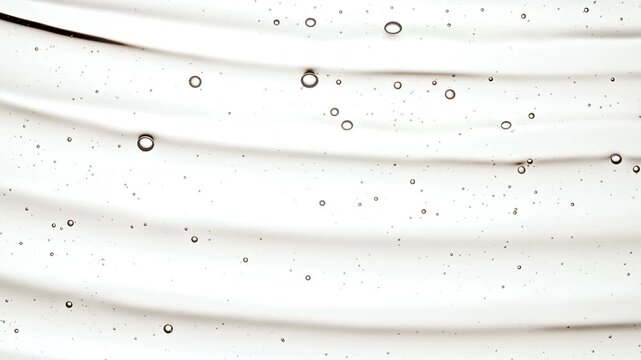 Closeup Shot of Clear Cosmetic Gel Fluid, Essential Oil With Molecule Bubbles Flowing on White Background. Macro Shot of Organic Products, Medicine. Dermatology Science Laboratory. . High quality 4k