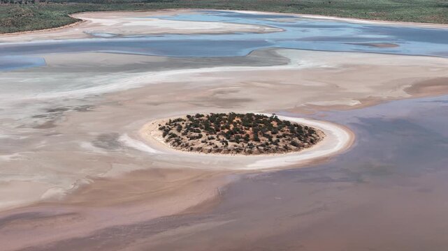 Aerial Lake Amadeus salty mud basin is the largest salt lake in Northern Territory Australia, about 50 km north of Uluru or Ayers Rock, stretching 180 kilometers long and 10 kilometers wide, salt lake