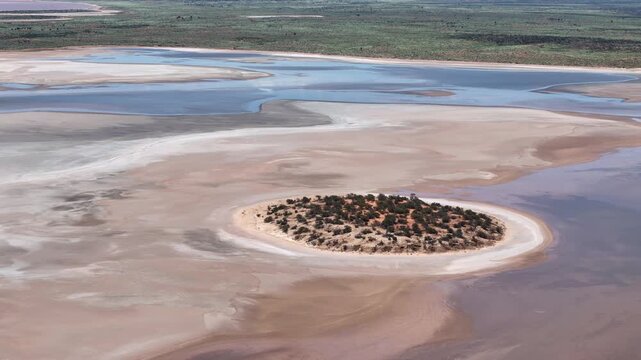 Aerial Lake Amadeus salty mud basin is the largest salt lake in Northern Territory Australia, about 50 km north of Uluru or Ayers Rock, stretching 180 kilometers long and 10 kilometers wide, salt lake