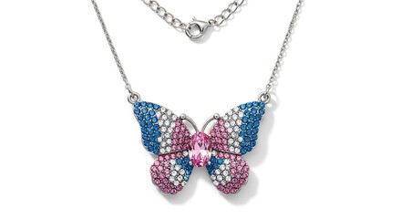 Elegant silver chain necklace featuring a dazzling butterfly pendant encrusted with multicolored sparkling crystals isolated on a white background. 