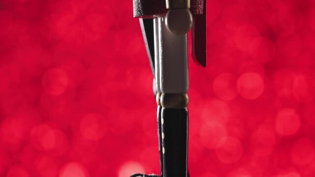 The Nutcracker is being revealed by moving the camera up while it is turning to the camera, it's face is illuminated at the end