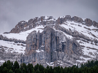 Extreme close up of heavily textured layered limestone rock face