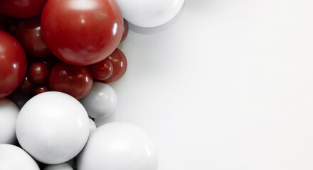 Minimalist balloon arrangement with red and white balloons on a clean white background, creating modern party decor and copy space for celebration designs.