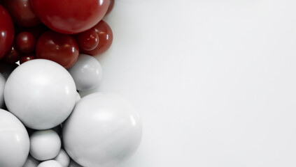 Minimalist balloon arrangement with red and white balloons on a clean white background, creating modern party decor and copy space for celebration designs.
