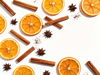 Dried orange slices and cinnamon sticks arranged on white background  