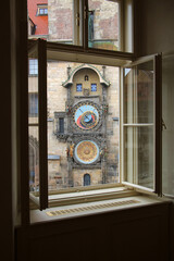 A window view of a famous Prague landmark, the Orloj Clock, Czech Republic.