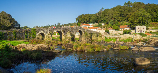 Stone bridge over Tambre river in Ponte Maceira