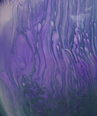 Lilac abstract background. The acrylic paint flows and creates a unique pattern. The texture of natural stone. 