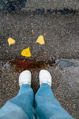 White barefoot shoes on wet asphalt background 