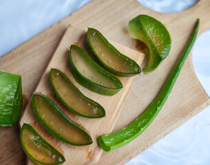 	
Aloe vera fresh leaves on wooden  cutting board
