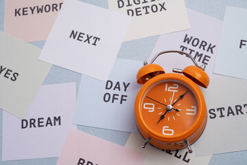 Time and task management. Alarm clock surrounded by goals, skills, and productivity keywords