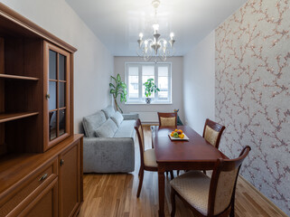 Interior photo of Living room with furniture, table and decorative elements.