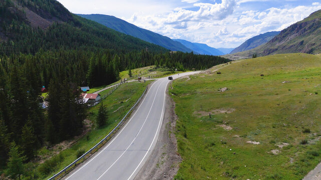 A cyclist rides along the Chuy Highway in the Altai Mountains, as seen from a drone