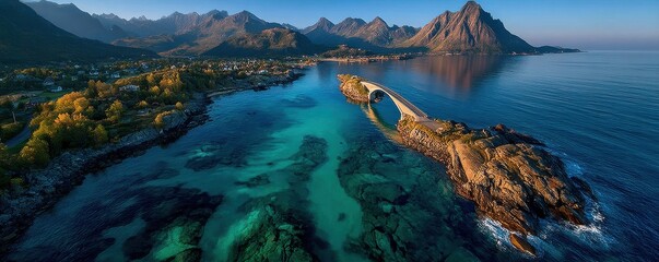 Aerial view of a turquoise island with a graceful bridge spanning clear water and rugged mountains