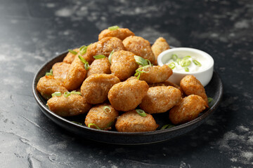 Crispy Jalapeno cheese bites with sauce. Party food snacks