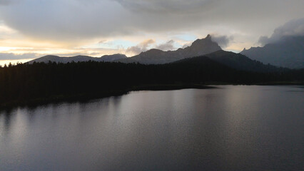 Mountain Lake Svetloe in the Yergaki Nature Park, with mountains in the clouds on the horizon