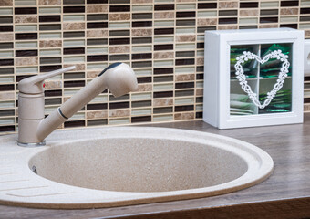 Sink and faucet in the bathroom.