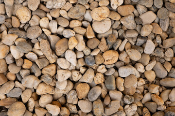 Natural river pebbles stone texture background
