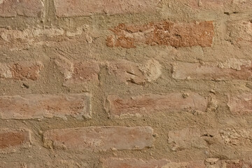 Rustic clay brick wall texture background
