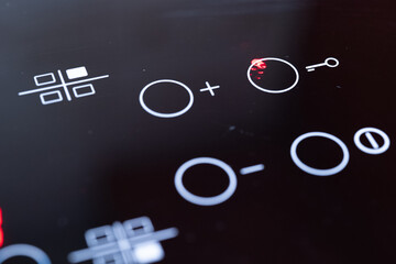 Close-up of modern touch control induction cooktop
