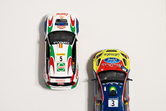 Bucharest Romania 23 November 2025.Scale models of a 2008 Ford Focus WRC and a 1998 Toyota Corolla WRC racing side by side, featuring detailed rally livery and dynamic motion on a miniature track
