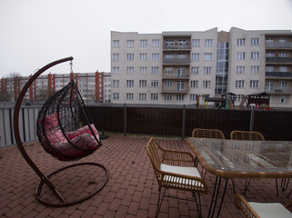 A terrace of an apartment in a multi-apartment building with a recreation area.