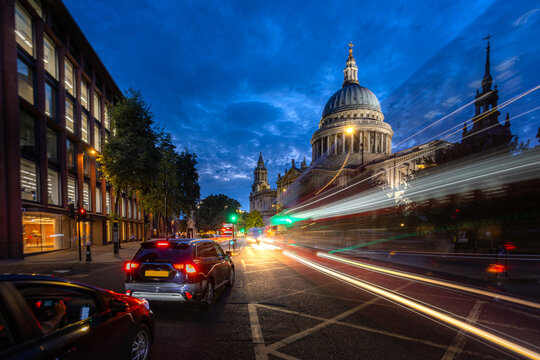 red bus the famous public transportation for business and travel in London with St. Paul's Cathedral dome famous landmark tourist destination in London United Kingdom, UK, British, England in European