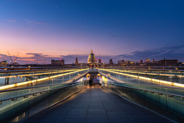 St. Paul's Cathedral from Millennium Bridge over Thames river famous travel destination landmark and city landscape of the city of London, London Capital City of UK, United Kingdom, British, Britain