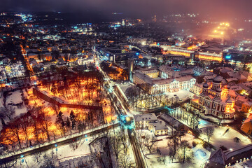 Aerial night View of Tallinn in winter with Alexander Nevsky Cathedral, roofs with snow, Christmas mood